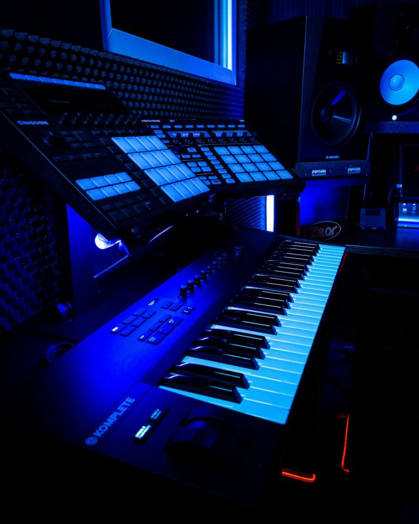 View of a Native Instruments Maschine MK3 & MK2 sampler drum machines and komplete kontrol synth in a recording studio at Orbital 101 Studio.